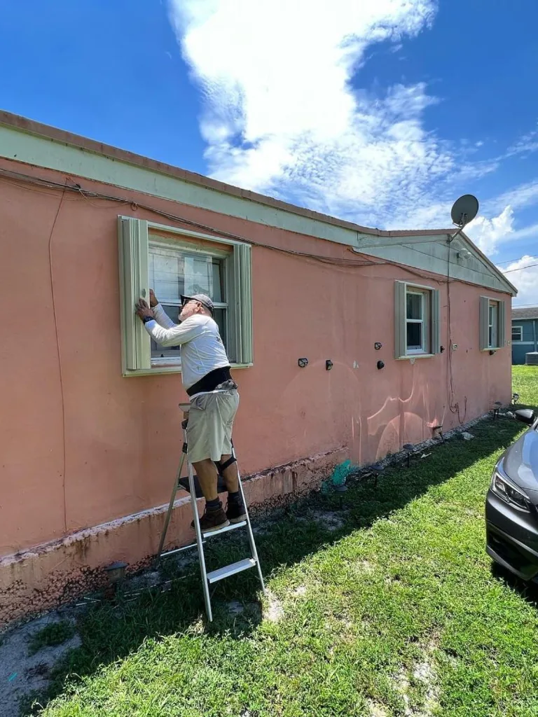 Installation crew adding shutters